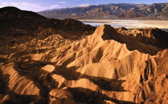 Scenic view of Death Valley sand dunes and mountains.